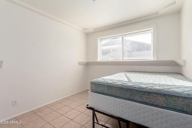 214 W June Cir, Mesa, AZ 85201 - bedroom with light tile patterned floors and baseboards