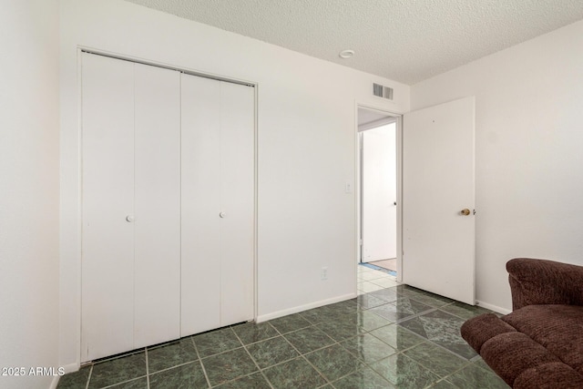214 W June Cir, Mesa, AZ 85201 - bedroom with a textured ceiling and a closet