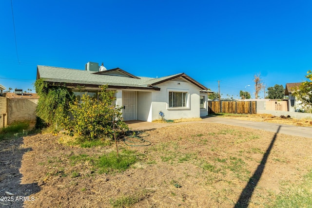 214 W June Cir, Mesa, AZ 85201 - back of house with stucco siding, roof with shingles, and a chimney