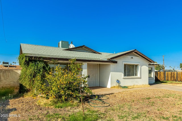 214 W June Cir, Mesa, AZ 85201 - rear view of property with stucco siding, a shingled roof, and a chimney