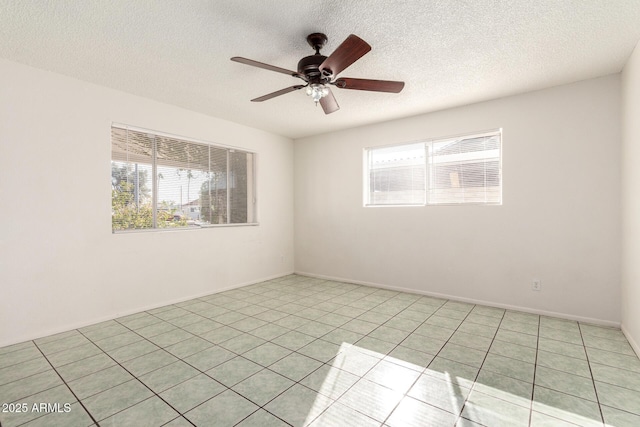 214 W June Cir, Mesa, AZ 85201 - spare room with a ceiling fan, a textured ceiling, and light tile patterned floors