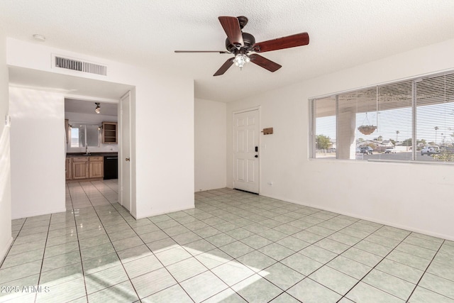 214 W June Cir, Mesa, AZ 85201 - empty room featuring ceiling fan, a sink, and light tile patterned flooring