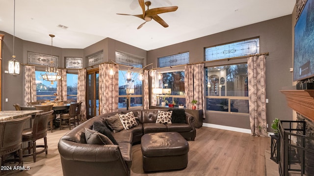 living room with wood-type flooring and ceiling fan