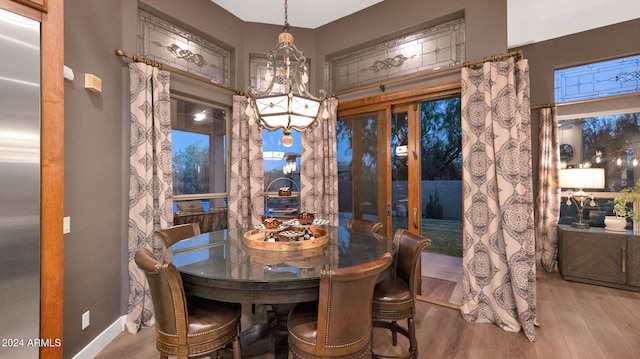 dining space featuring wood-type flooring