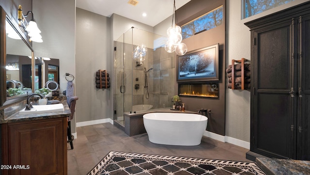 bathroom with separate shower and tub, tile patterned floors, and vanity