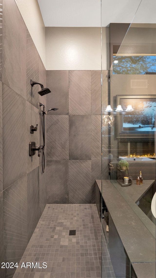 bathroom with a tile shower