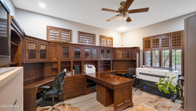 office area featuring light hardwood / wood-style flooring and ceiling fan