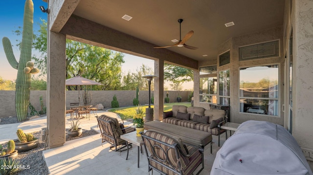 view of patio / terrace featuring ceiling fan and an outdoor living space