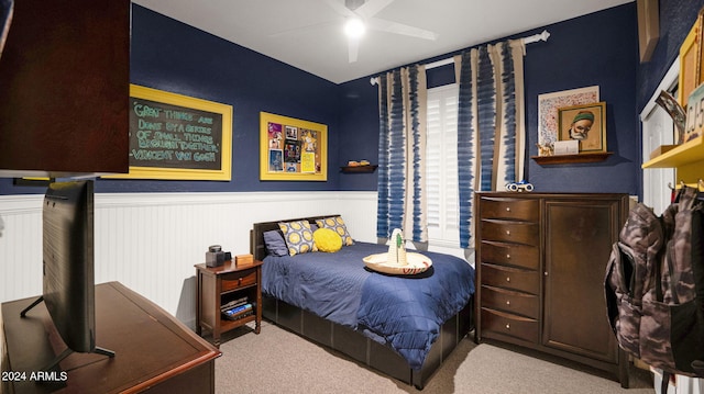 bedroom featuring ceiling fan and light colored carpet