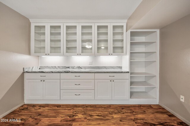 empty room featuring hardwood / wood-style floors, a textured ceiling, and ceiling fan