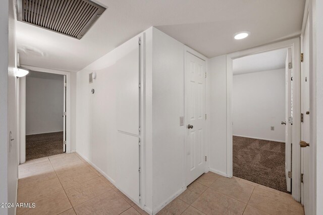 spare room featuring carpet flooring, ceiling fan, and a textured ceiling