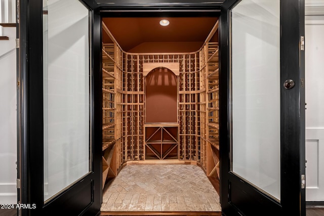 wine room featuring lofted ceiling