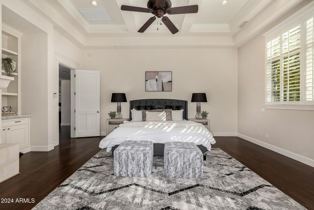 bedroom with ceiling fan, dark hardwood / wood-style floors, beam ceiling, and coffered ceiling