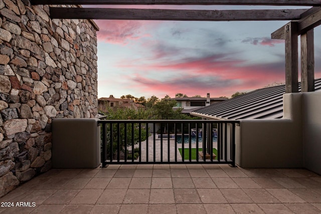 view of balcony at dusk