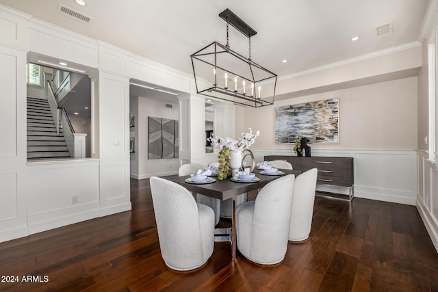 dining room featuring crown molding and dark wood-type flooring