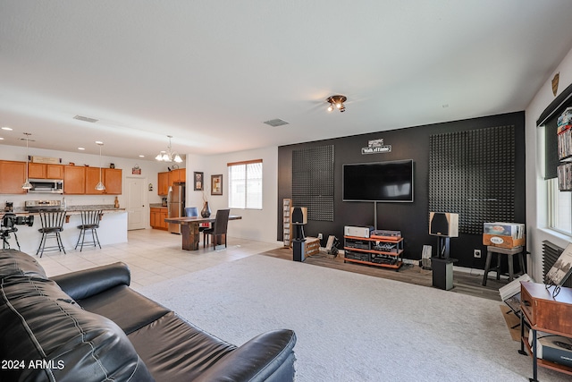 tiled living room featuring an inviting chandelier