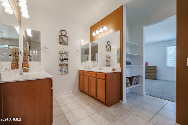 bathroom with tile patterned flooring, an enclosed shower, and vanity