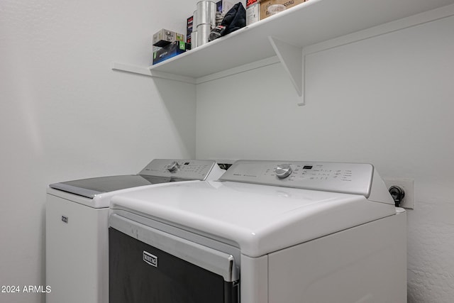 laundry area with washer and clothes dryer