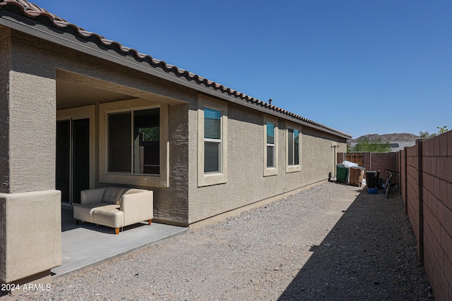 view of side of home featuring a patio area