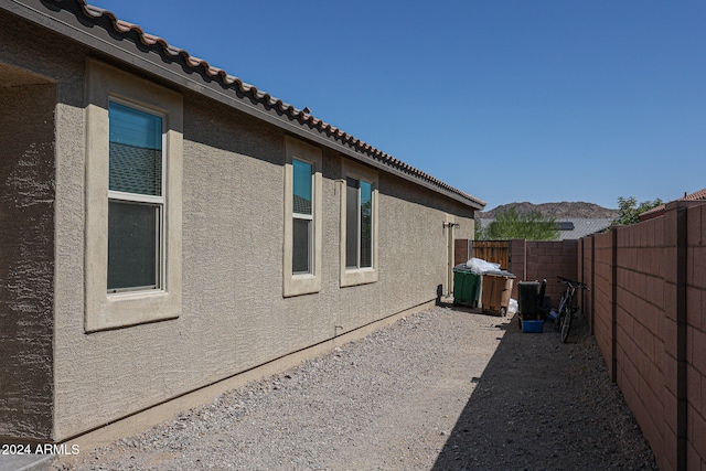 view of property exterior featuring a mountain view