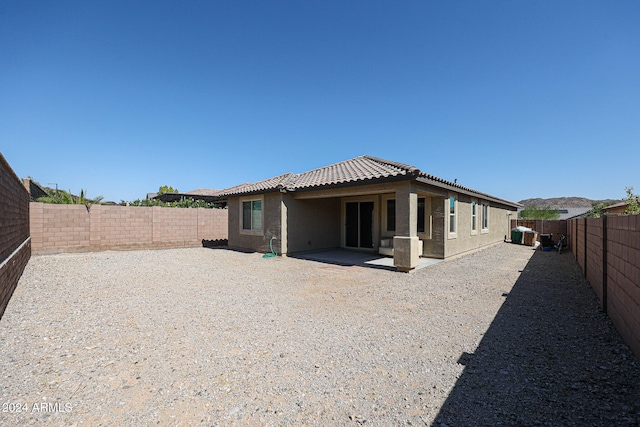 rear view of property with a patio area