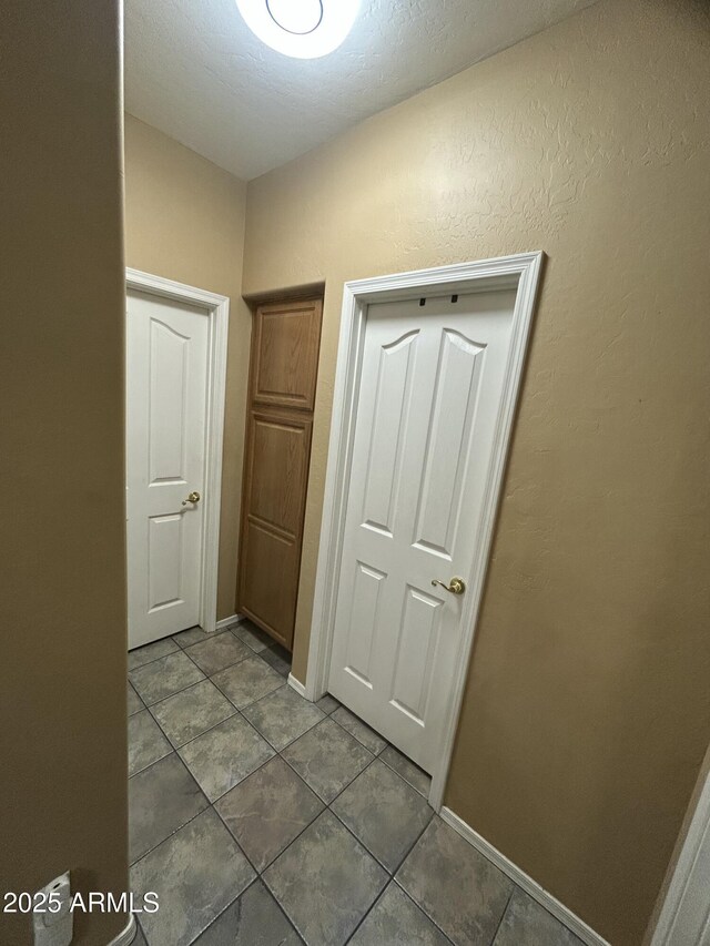 7326 W Dreyfus Dr, Peoria, AZ 85381 - corridor featuring tile patterned flooring and baseboards