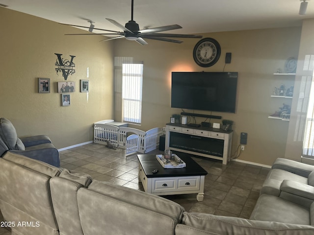 7326 W Dreyfus Dr, Peoria, AZ 85381 - living room with ceiling fan, baseboards, and dark tile patterned floors