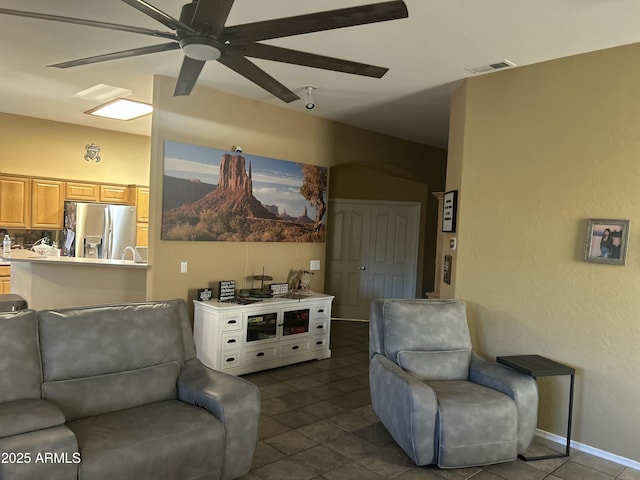 7326 W Dreyfus Dr, Peoria, AZ 85381 - living room with a ceiling fan and dark tile patterned flooring