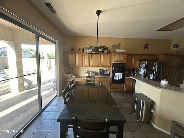 7326 W Dreyfus Dr, Peoria, AZ 85381 - dining space featuring dark tile patterned flooring