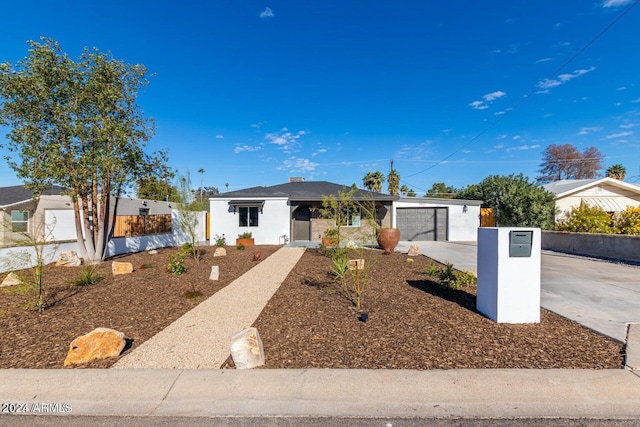 ranch-style home featuring a garage