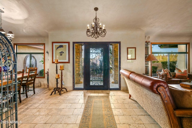 entrance foyer featuring a notable chandelier