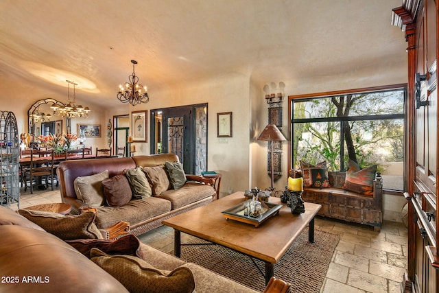 living room featuring a chandelier and vaulted ceiling