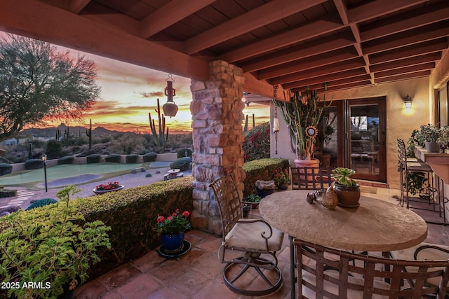 view of patio terrace at dusk