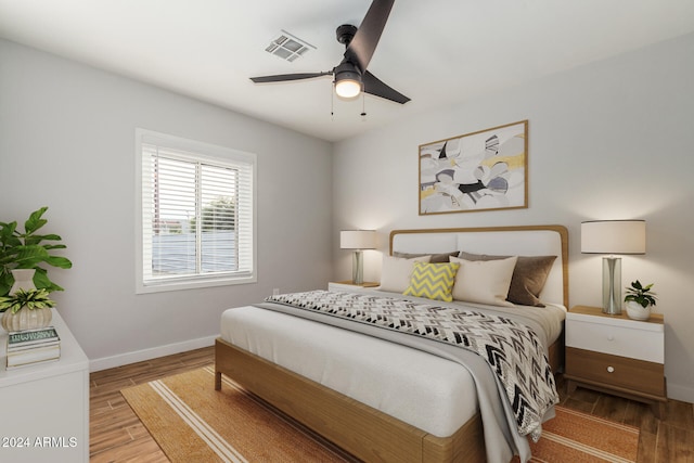 bedroom featuring hardwood / wood-style floors and ceiling fan