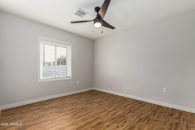 unfurnished room featuring hardwood / wood-style floors and ceiling fan