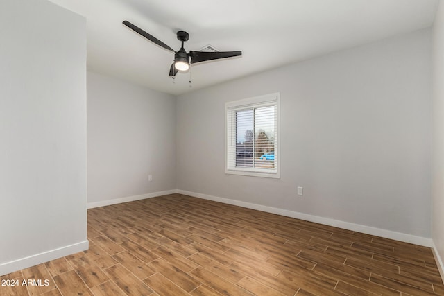 unfurnished room with ceiling fan and wood-type flooring