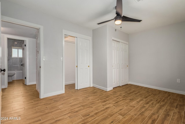 unfurnished bedroom with connected bathroom, ceiling fan, and light wood-type flooring