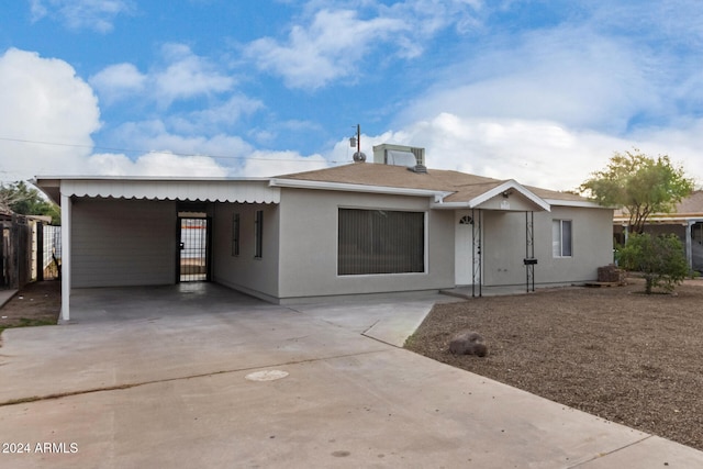 view of front of property with a carport