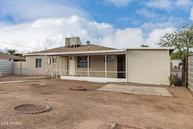 back of property with central AC unit