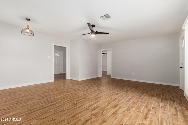 unfurnished room with ceiling fan and light wood-type flooring