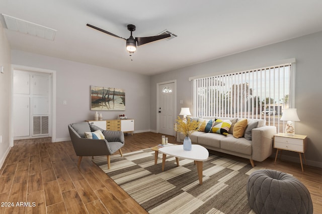 living room with hardwood / wood-style flooring and ceiling fan