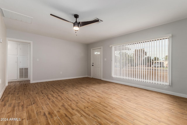 unfurnished room featuring ceiling fan and light hardwood / wood-style floors