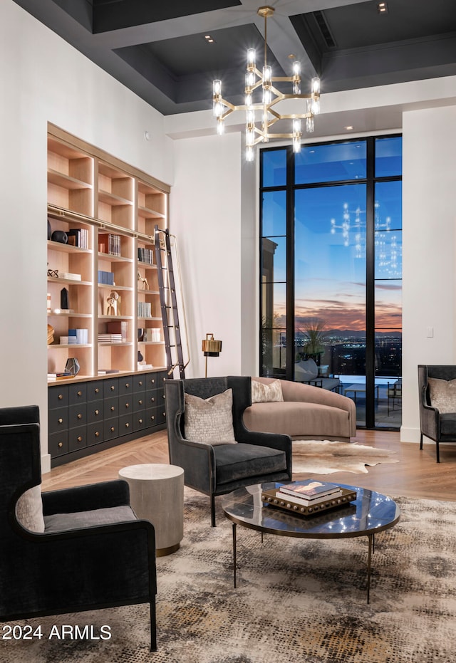 living room featuring a chandelier and hardwood / wood-style flooring