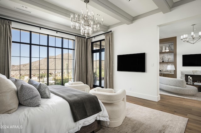 20958 N 112th St, Scottsdale, AZ 85255 - bedroom with a chandelier, beamed ceiling, wood finished floors, and a mountain view