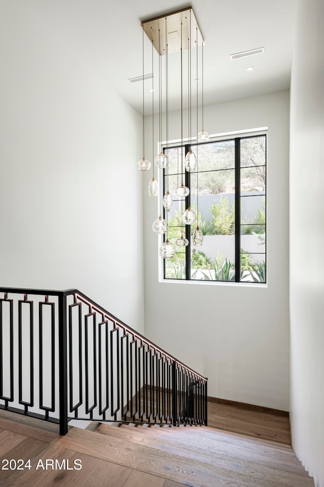 stairway featuring hardwood / wood-style flooring