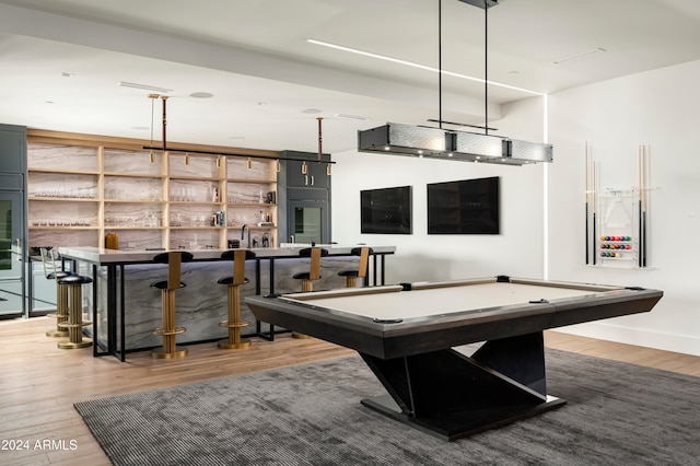 game room featuring bar area, hardwood / wood-style floors, and pool table