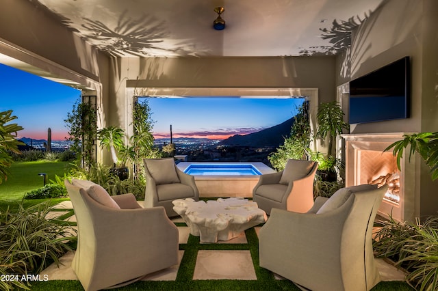 view of patio terrace at dusk