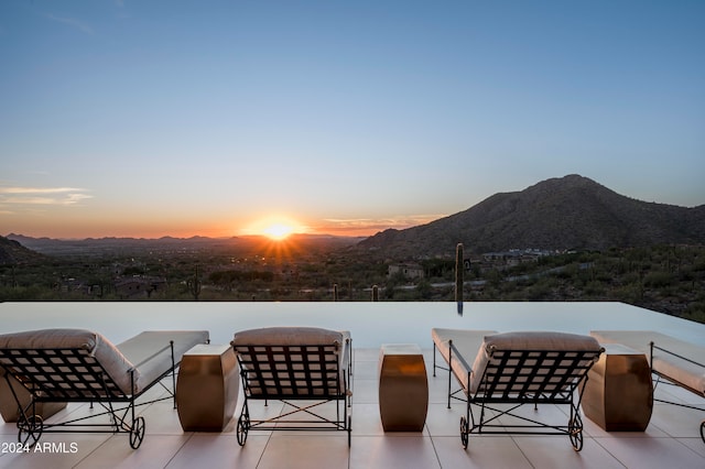 patio terrace at dusk with a mountain view