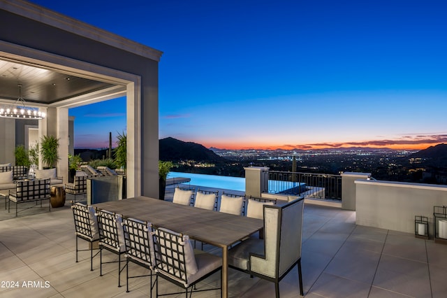 patio terrace at dusk with a mountain view