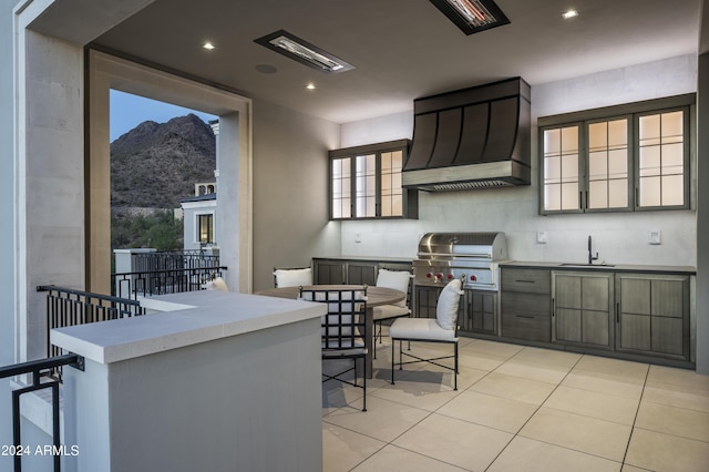 20958 N 112th St, Scottsdale, AZ 85255 - kitchen featuring custom range hood, light tile patterned flooring, a mountain view, recessed lighting, and healthy amount of natural light
